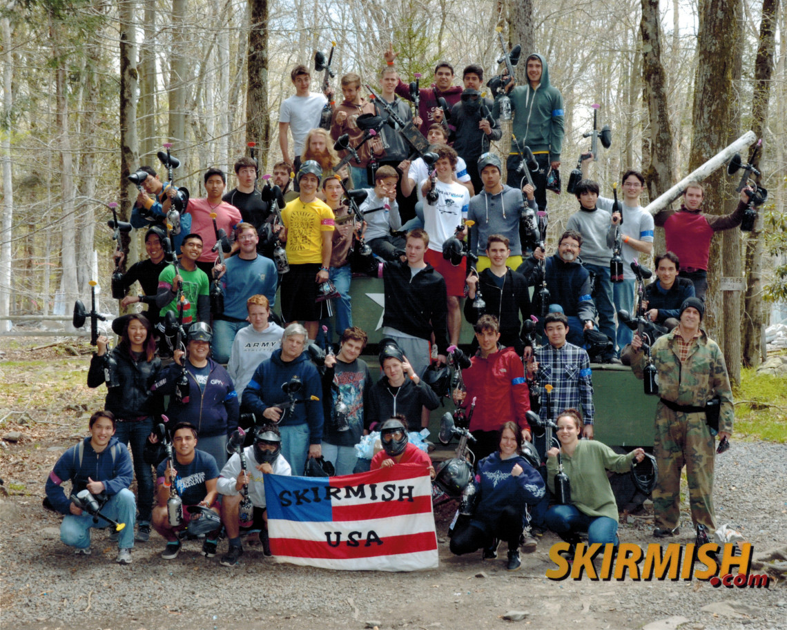 Photo of all the 2014 Shehaqua Paintball players holding their guns up.